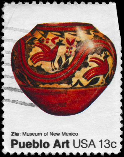 A picture shows an old stamp showing the Pueblo Art USA 13c