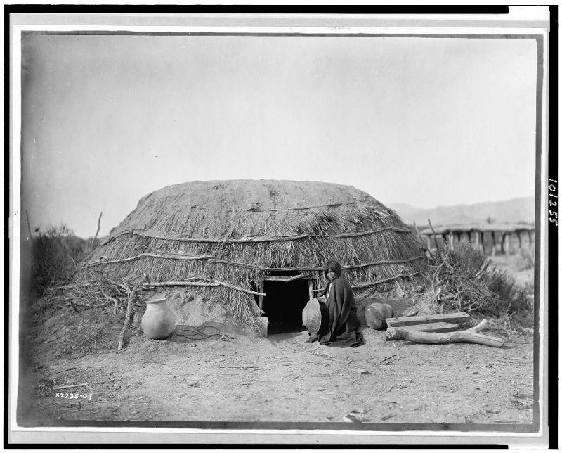 Picture shows traditional Oodham house made of brush, 1907