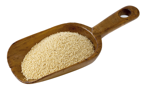 amaranth grain on a rustic wooden scoop