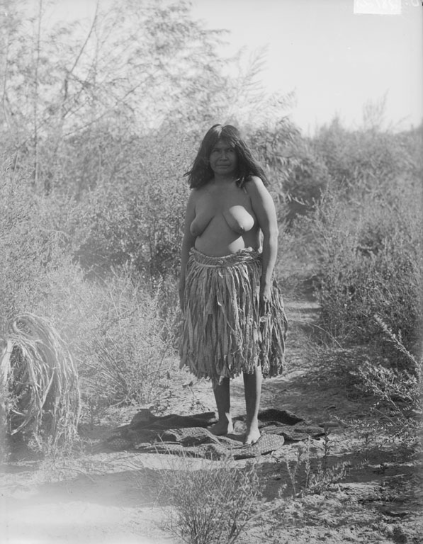 Woman wearing willow bark skirt.