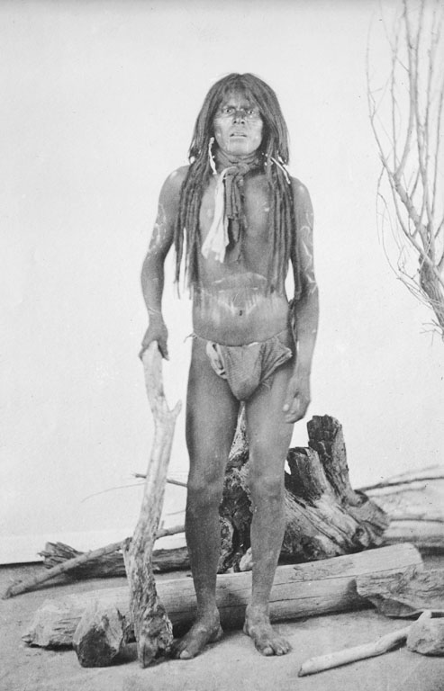 Picture shows a Mohave man exhibiting long rolled hair