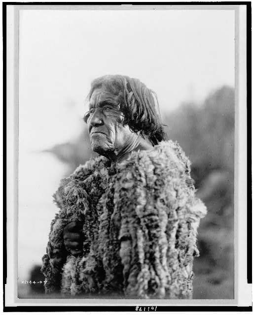 Black and white photograph of Pai (or possible Mohave) man wearing rabbit skin robe,1907.