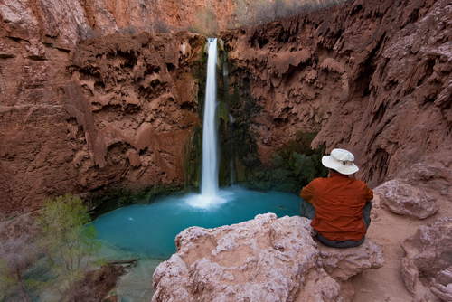 Picture shows Tourist at Mooney Falls, Havasu Canyon.