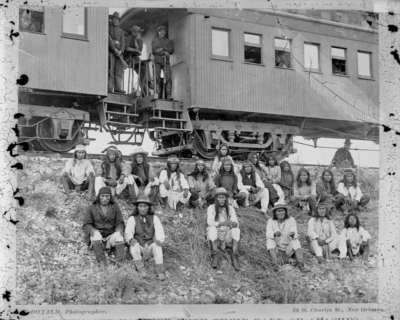 Picture shows Geronimo and his followers being taken as prisoners to Florida after their surrender in 1886