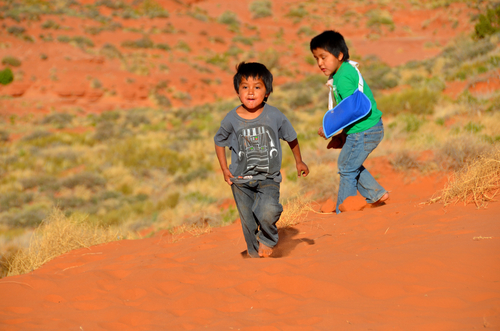 Picture shows children playing on the Navajo reservation